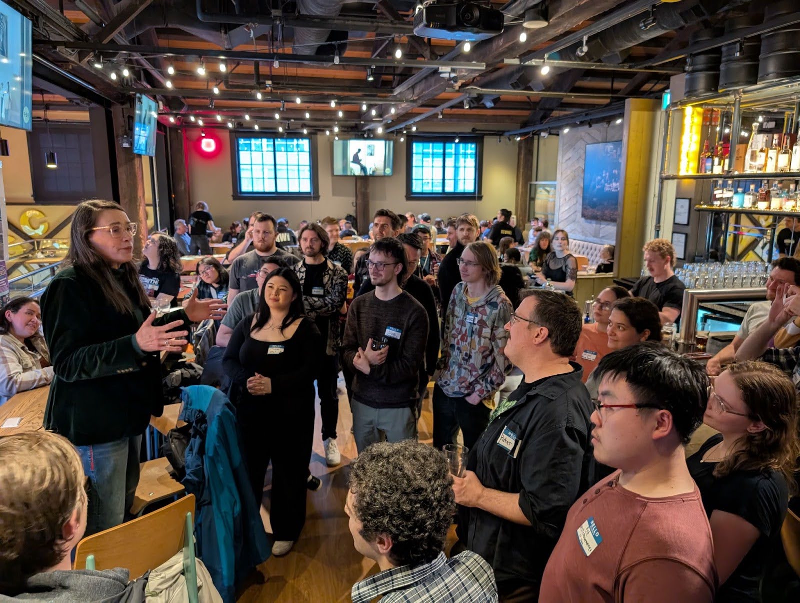 Lucy Maloney speaking at first Big Tent urbanist event in Mar 2025 at BREWHALL in Vancouver, BC.